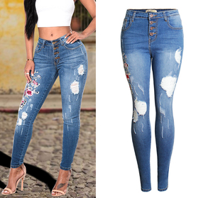 Stretch slim mid-high waist jeans with embroidered holes
